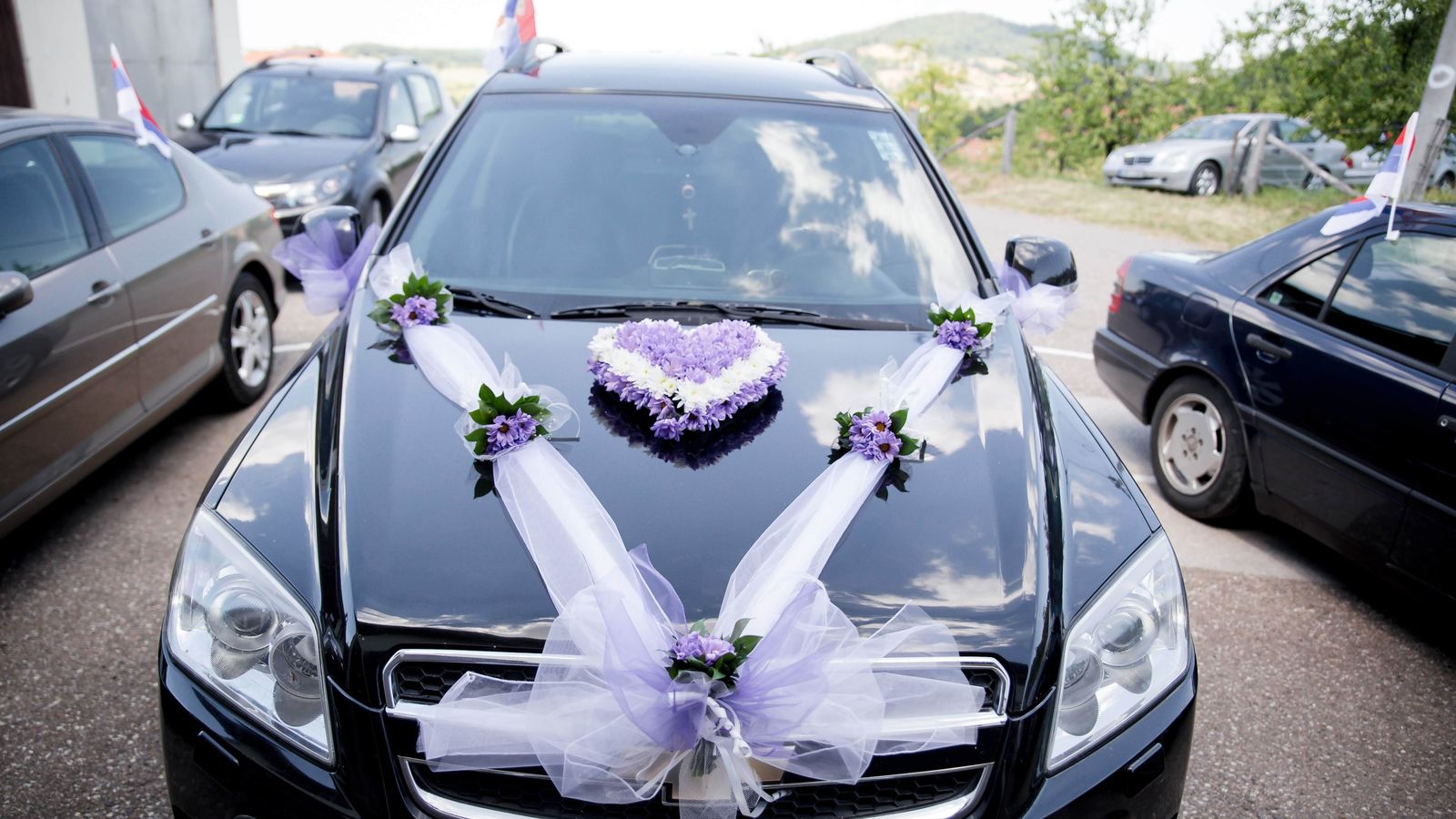 Wedding car decorated with flowers outside a hinterland venue near Bangalow