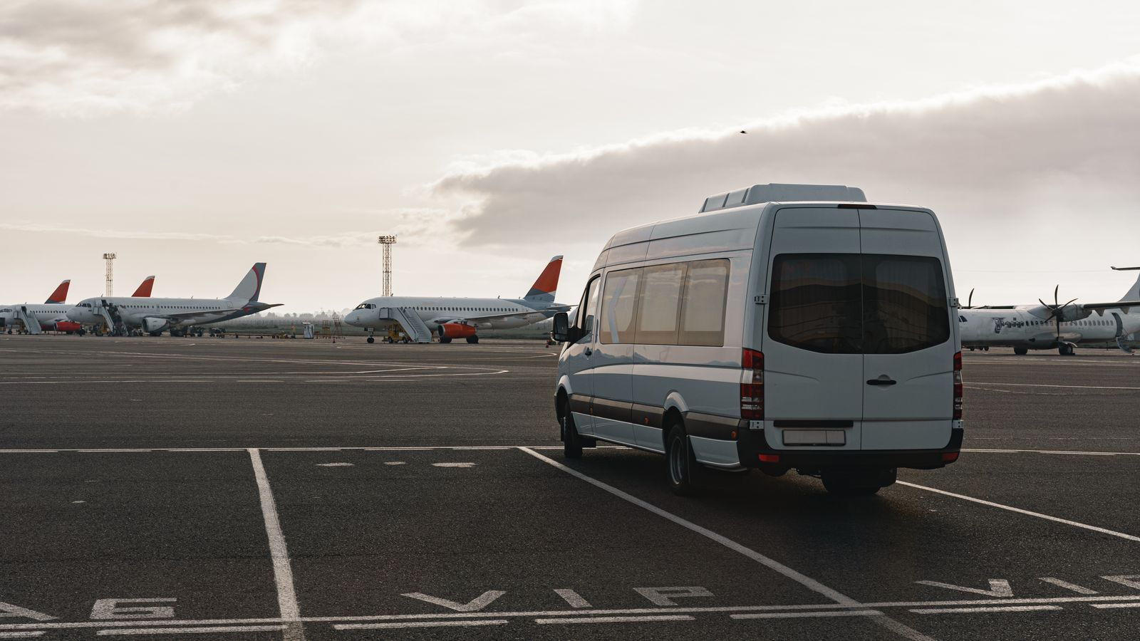 Six-seater van parked at a terminal, ready for a group 6-seater transfer